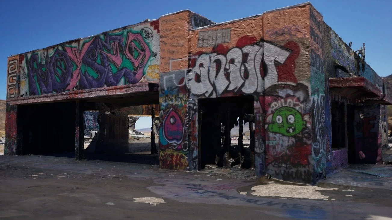 Front-on 3D render of the scanned graffiti building showing its open bays, purple lettering and a green cartoon face