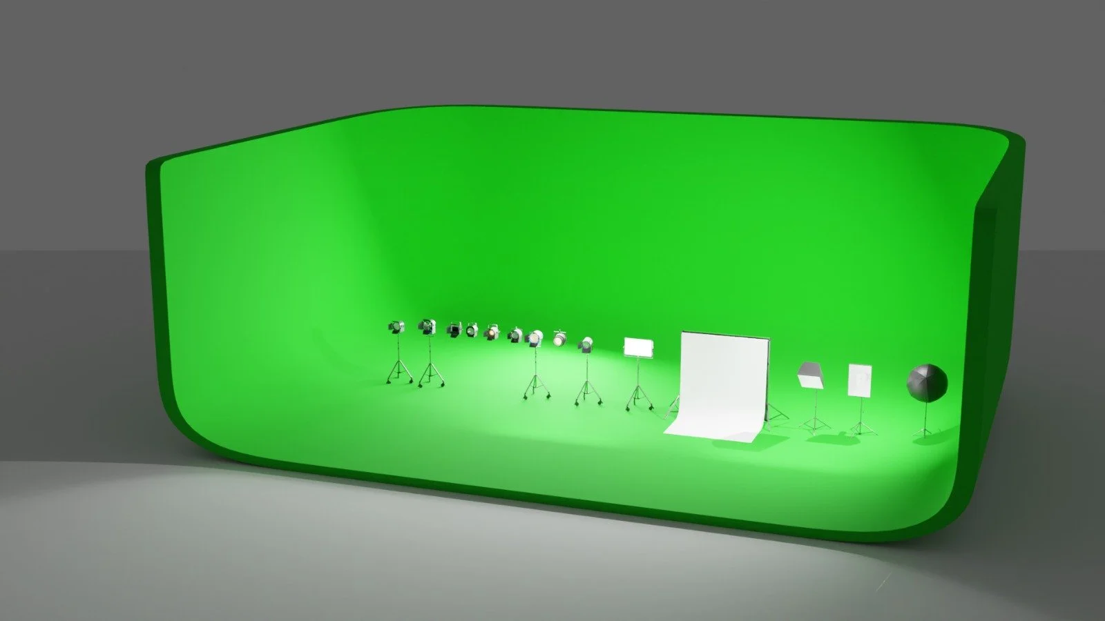 Green screen studio with lighting equipment, tripods, and backdrop stands.
